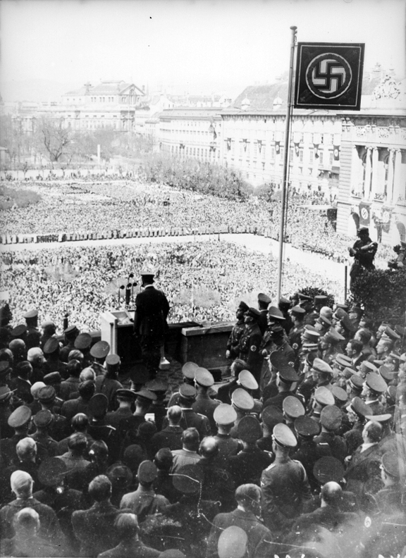 Adolf Hitler at the balcony of the Hofburg on the  Heldenplatz in Wien giving a speech after the Anschluss